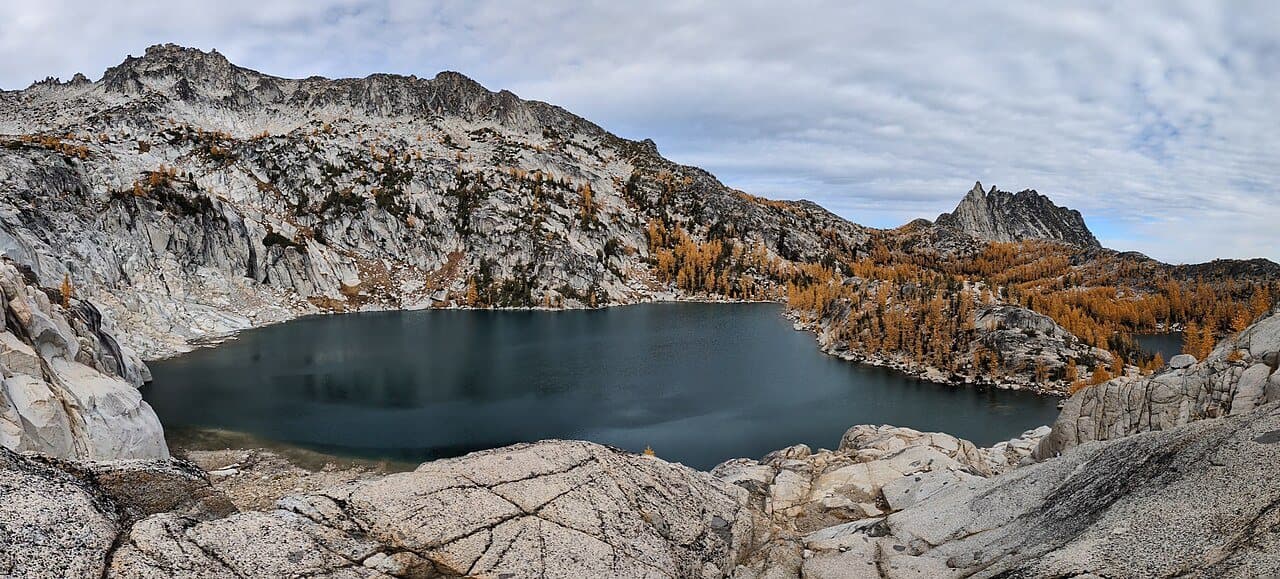 Inspiration Lake ringed by golden larches