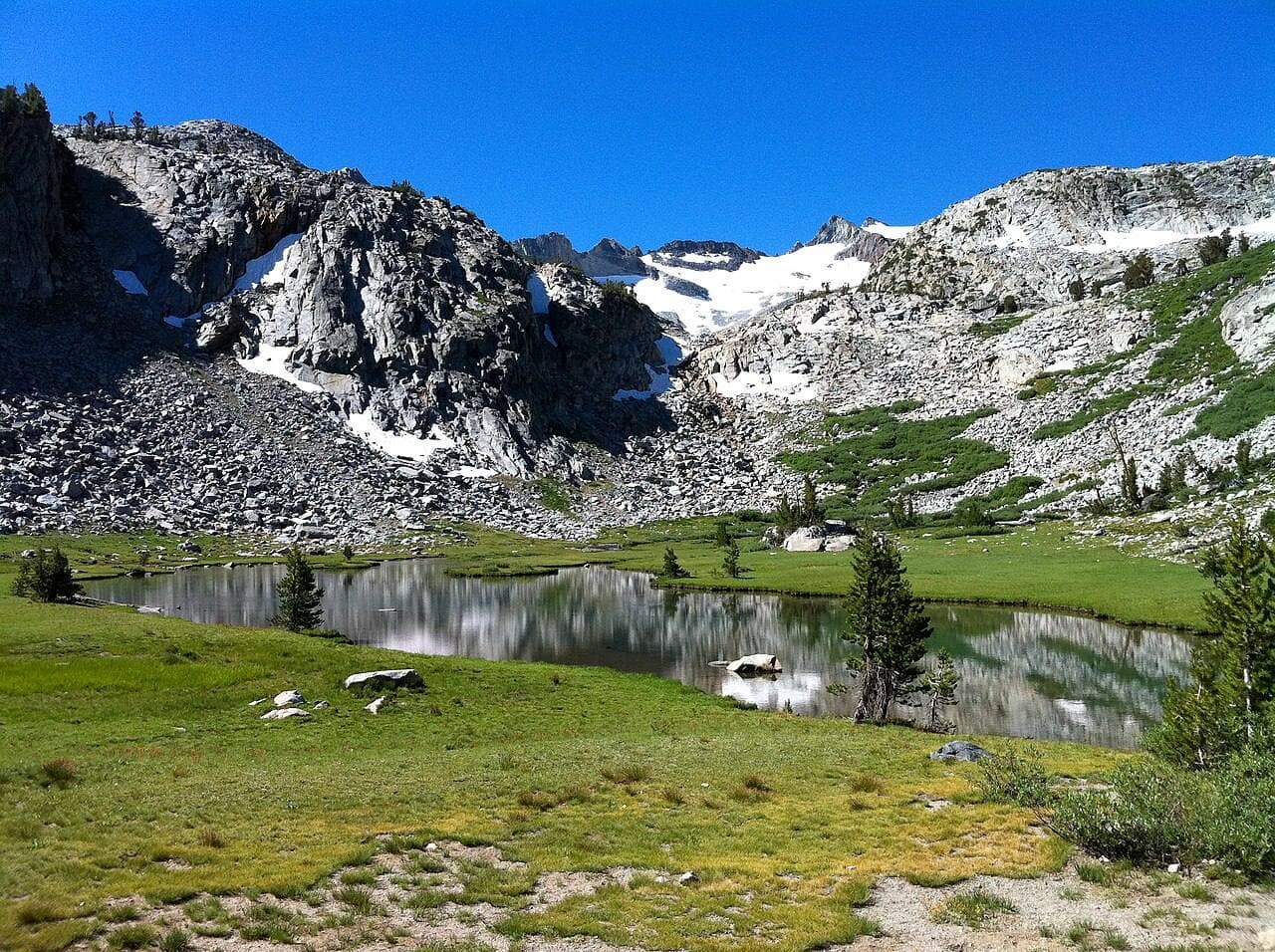Tarns and snowfields on the climb to Donohue Pass
