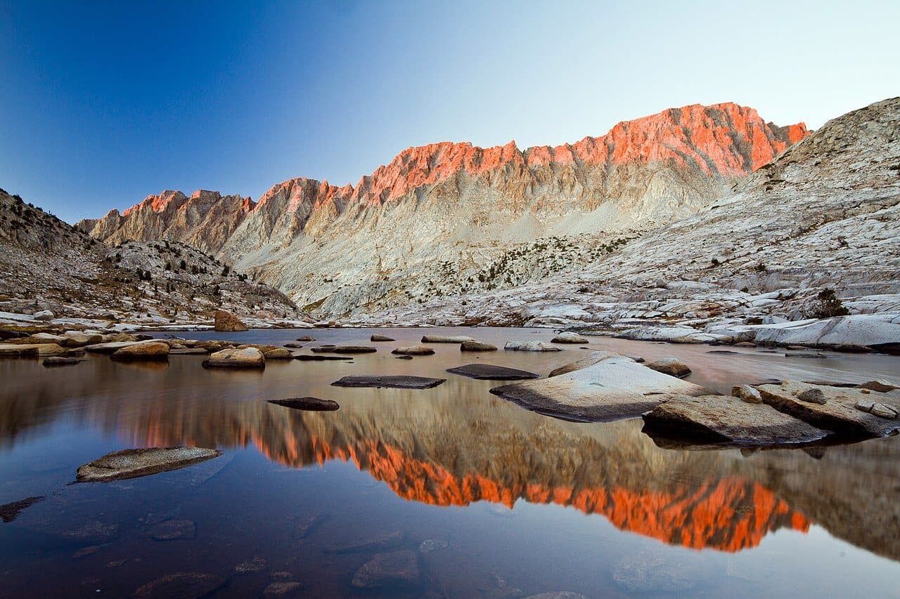 Mount Mendel and Mount Darwin reflected in Sapphire Lake at sunset