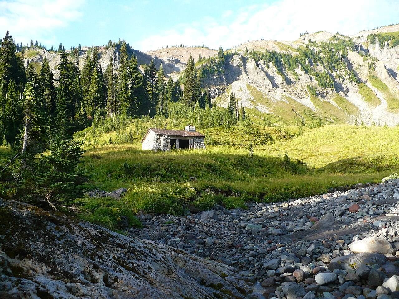 The stone shelter at Indian Bar in a green meadow