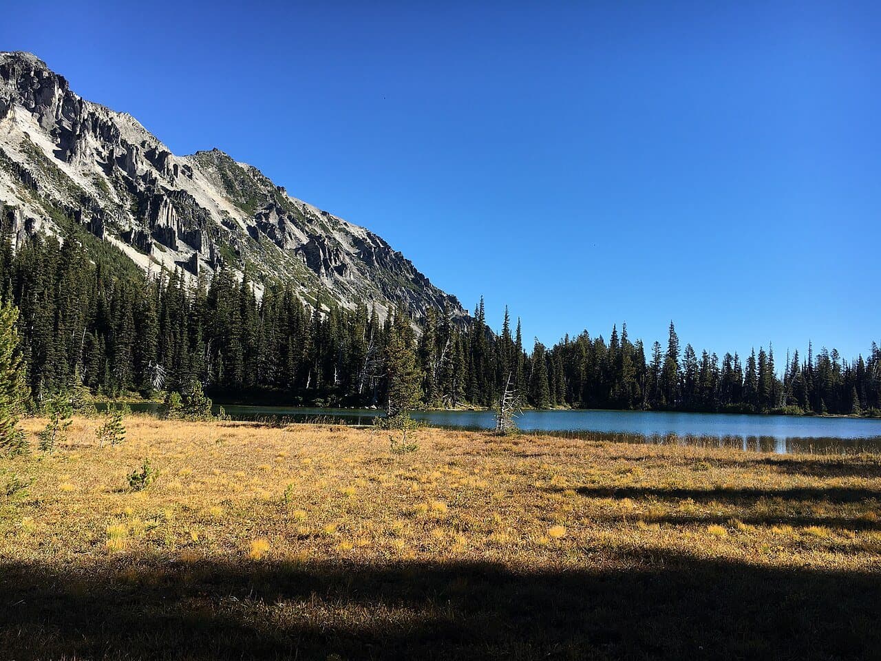 Mystic Lake below a rocky ridge, next to Mystic Camp